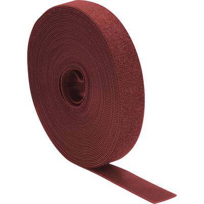 Un grand rouleau de ruban auto-agrippant rouge, utilisé pour connecter solidement des matériaux, avec une extrémité légèrement déroulée.