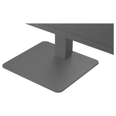 Un gros plan d'un support de moniteur rectangulaire gris foncé posé sur une surface plane, supportant un écran au-dessus.