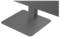 Un gros plan d'un support de moniteur rectangulaire gris foncé posé sur une surface plane, supportant un écran au-dessus.