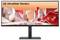 Moniteur UltraWide de LG affichant un paysage numérique futuriste avec des éléments géométriques rouges sur un fond blanc et orange vif.