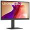 Écran LG UHD 4K montrant une œuvre d'art numérique abstraite en rouge et violet, avec un support et un cadre élégants et modernes en noir.