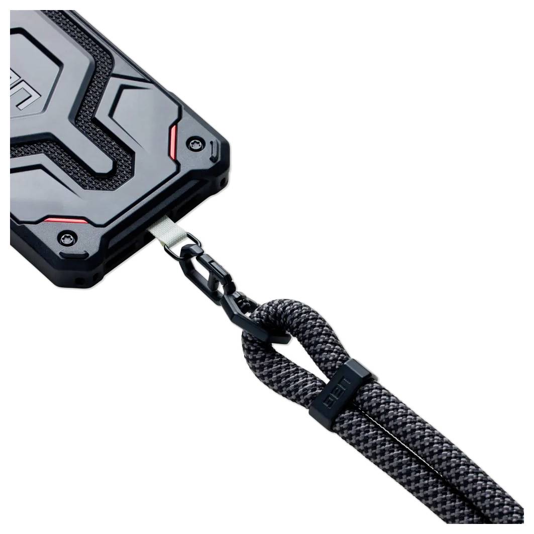 Un étui de téléphone robuste au design noir et rouge, fixé à un cordon tressé noir résistant avec un clip métallique.