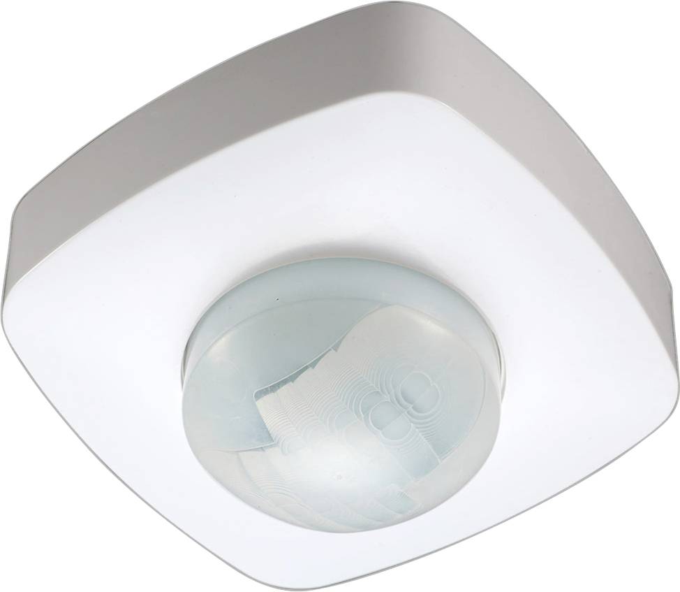 Un capteur de mouvement blanc monté au plafond, doté d'un objectif circulaire, utilisé pour détecter les mouvements et commander automatiquement l'éclairage.