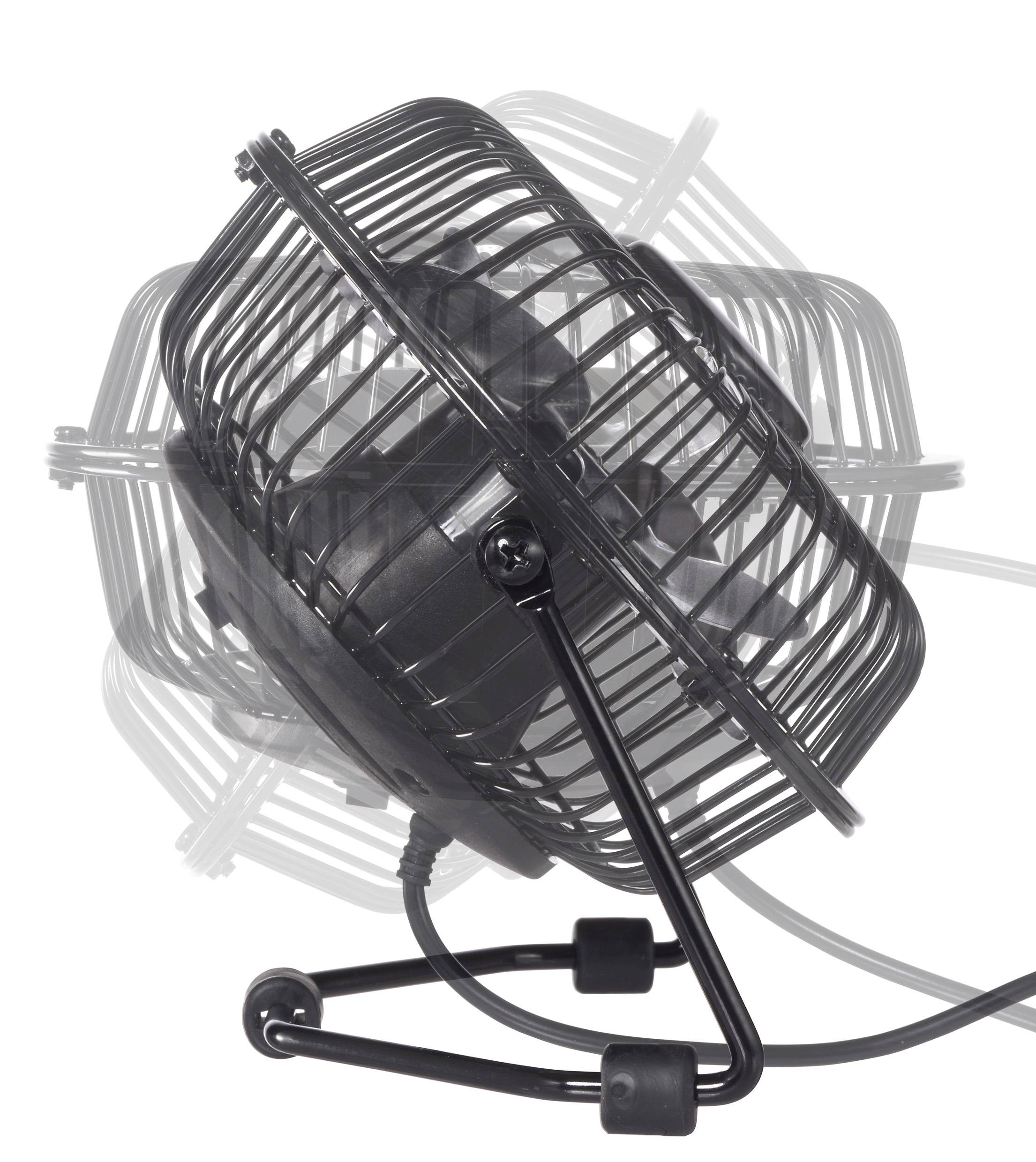 Un petit ventilateur de bureau noir oscille, présentant un flou de mouvement pour indiquer son déplacement latéral, avec un cordon d'alimentation branché.