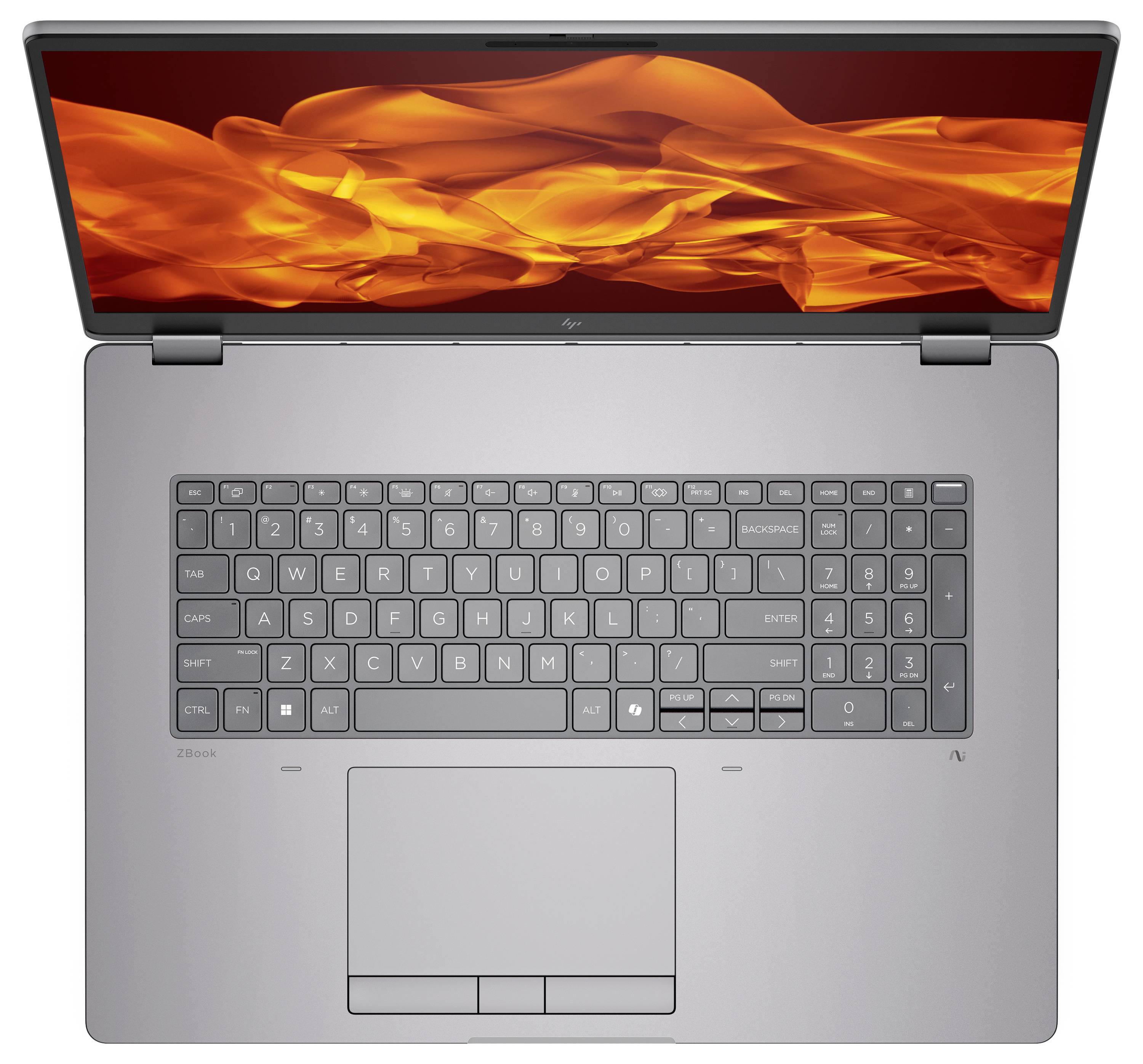 Un ordinateur portable argenté avec un clavier AZERTY, vu de dessus. L'écran affiche des flammes orangées abstraites, suggérant des performances élevées.