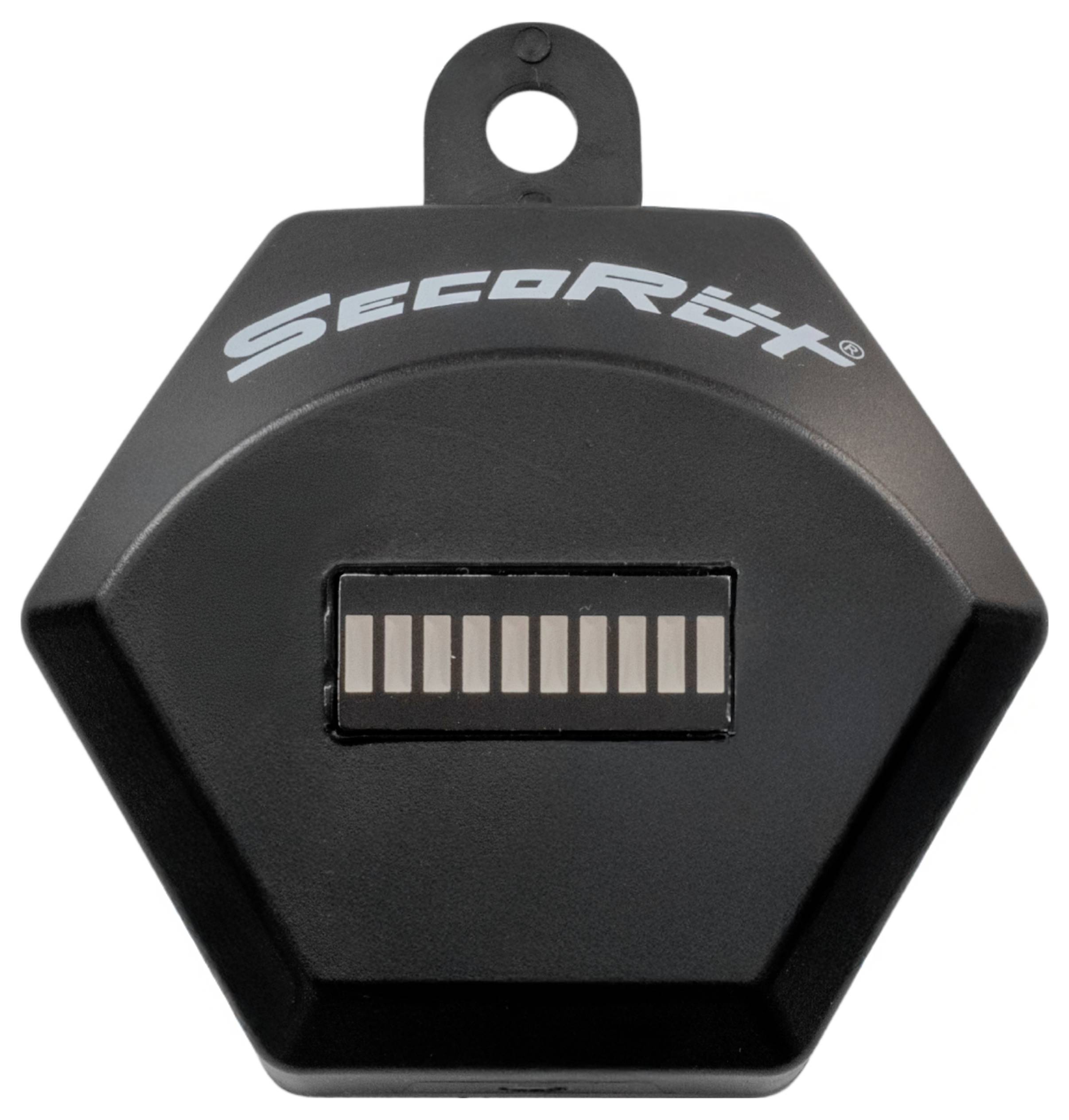 Un dispositif électronique noir hexagonal étiqueté « SecoRüt » avec un crochet sur le dessus, comportant une barre de petites lumières rectangulaires sur sa surface.