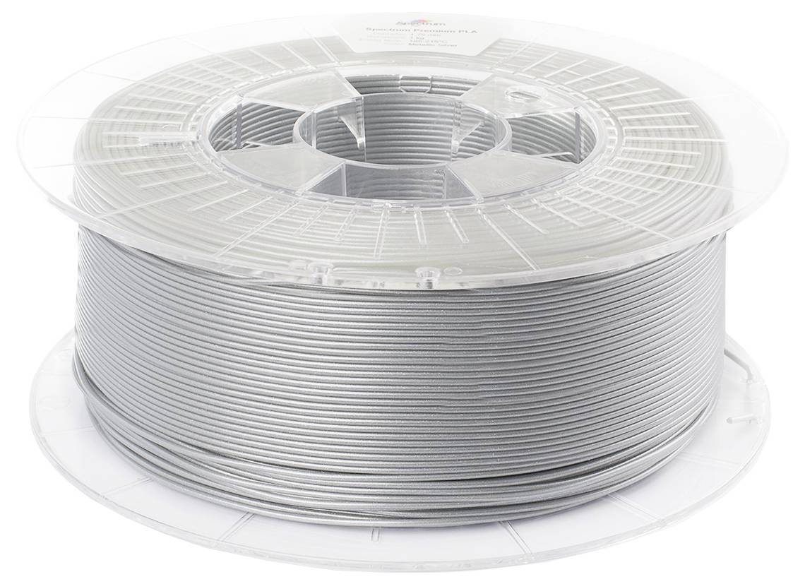 Un rouleau de filament d'impression 3D en argent, soigneusement enroulé et placé dans un support transparent en plastique.