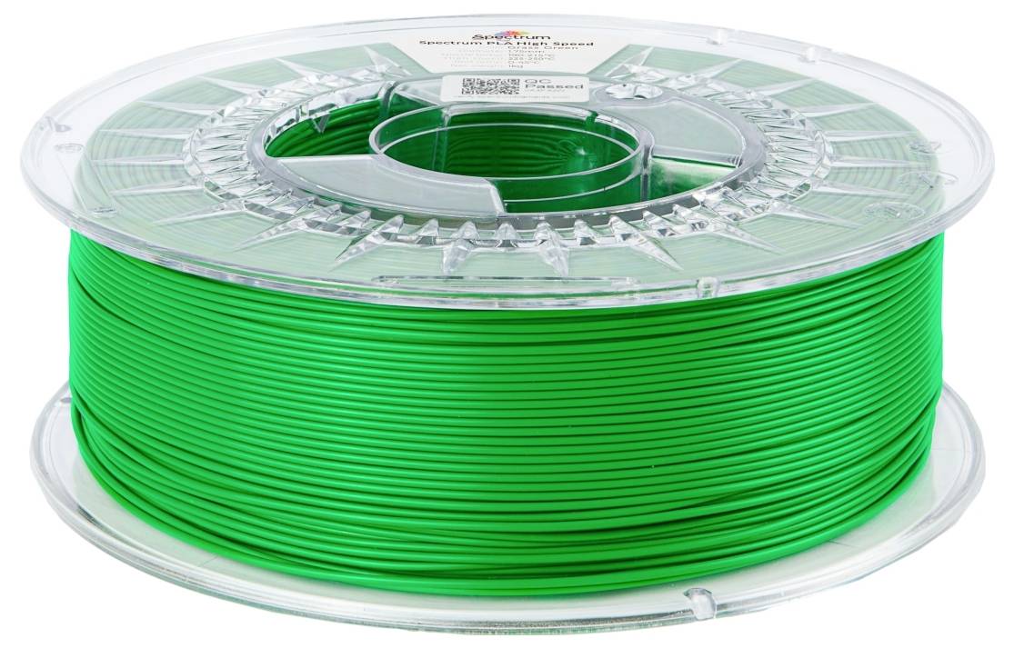 Bobine de filament vert pour imprimante 3D avec un axe en plastique transparent. L'étiquette sur la bobine indique la marque et les détails du matériau.
