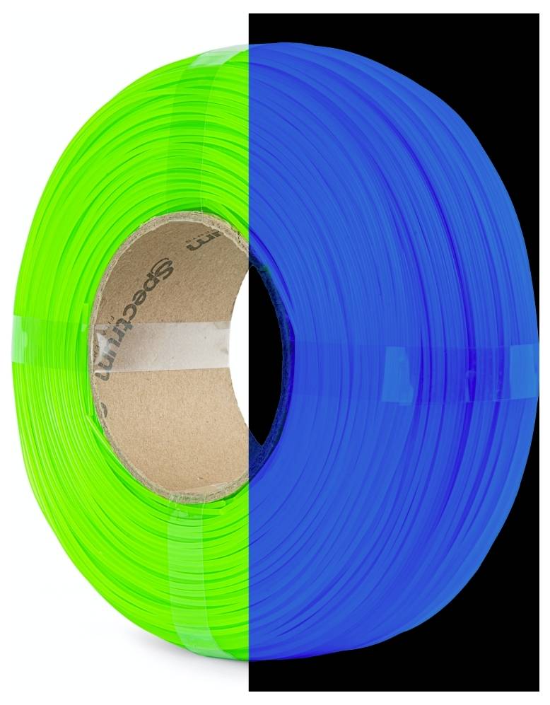 Un rouleau de ruban à moitié éclairé par une lumière verte et à moitié par une lumière bleue, illustrant le contraste des couleurs.