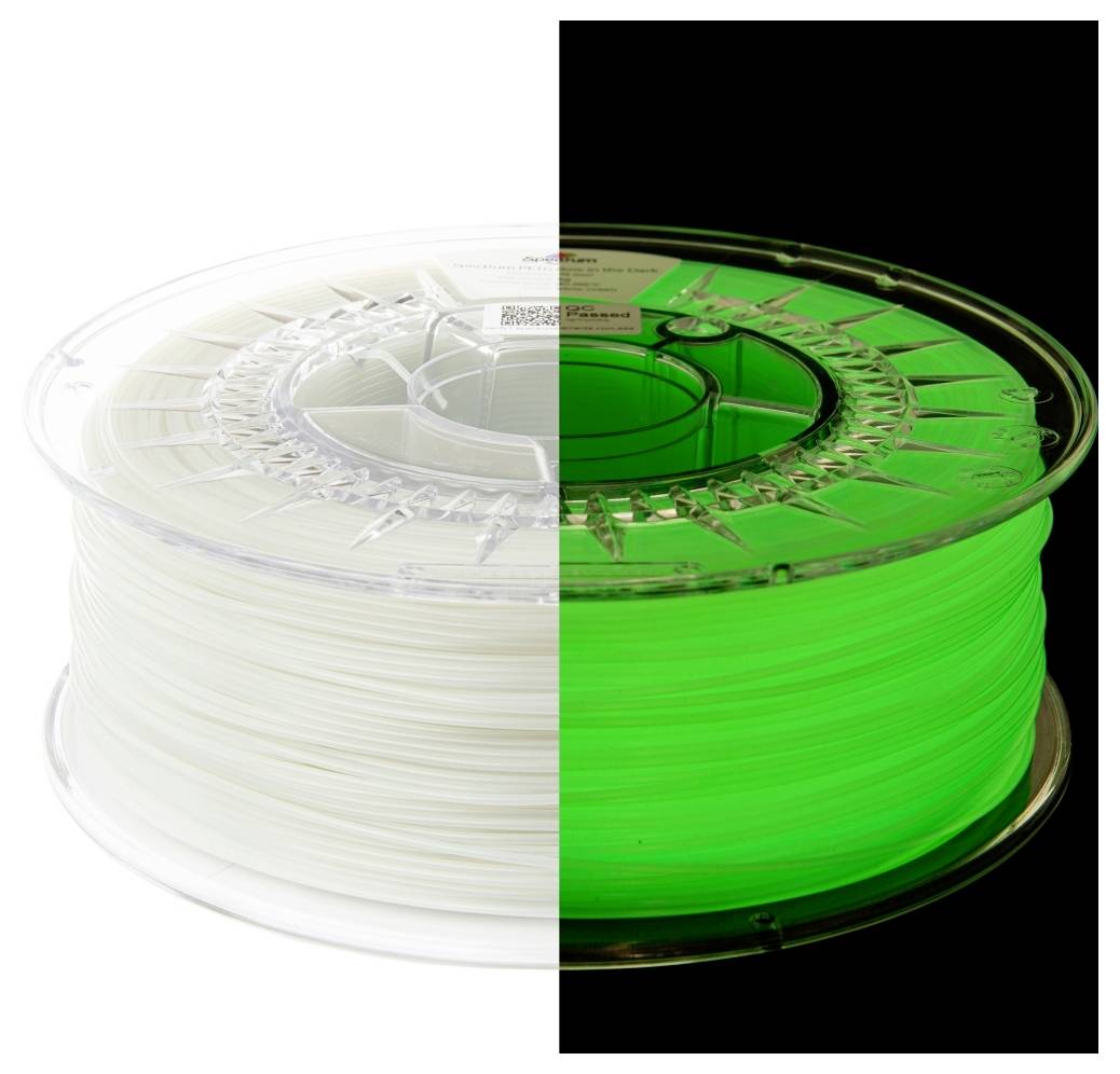 Une bobine de filament, moitié blanche et moitié vert fluorescent, illustrant son changement de couleur selon les conditions d'éclairage.