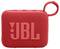 Un petit haut-parleur portable JBL rouge avec une texture tissée et une boucle de transport.