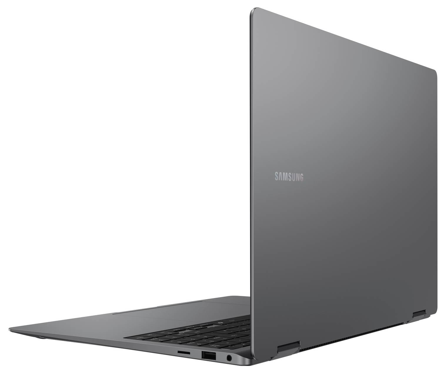 Un ordinateur portable gris à moitié ouvert, montrant un clavier et un écran noir. Le logo Samsung est visible sur le couvercle. L'ordinateur portable est sur un fond uni.