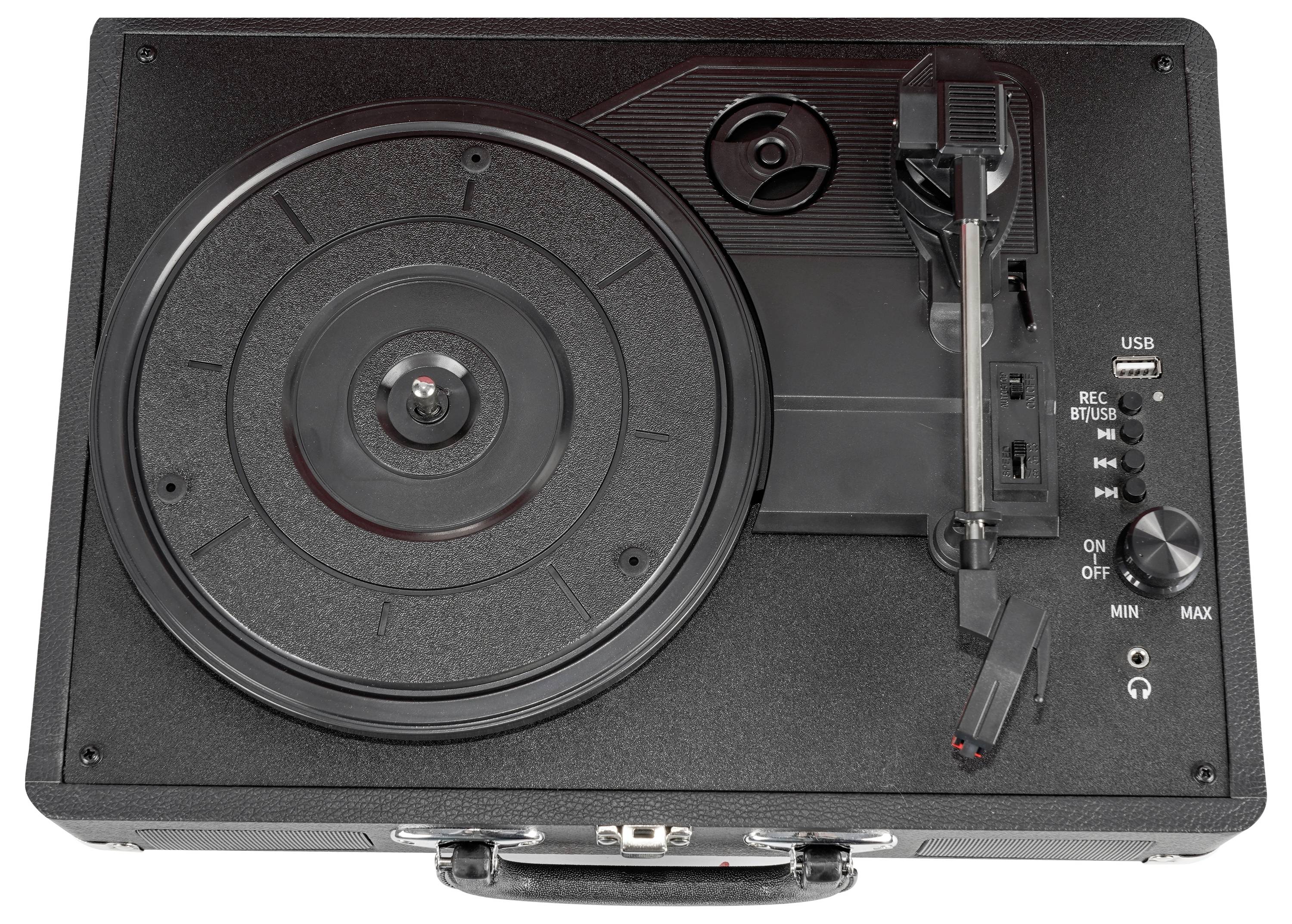 Une platine tourne-disques portable noire avec un port USB, des commandes de volume et un bras de lecture. La platine est rangée à l'intérieur d'une valise.
