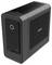 Un boîtier d'ordinateur compact noir avec des trous de ventilation et la marque « Zotac », doté d'un port USB frontal et d'un bouton d'alimentation circulaire.