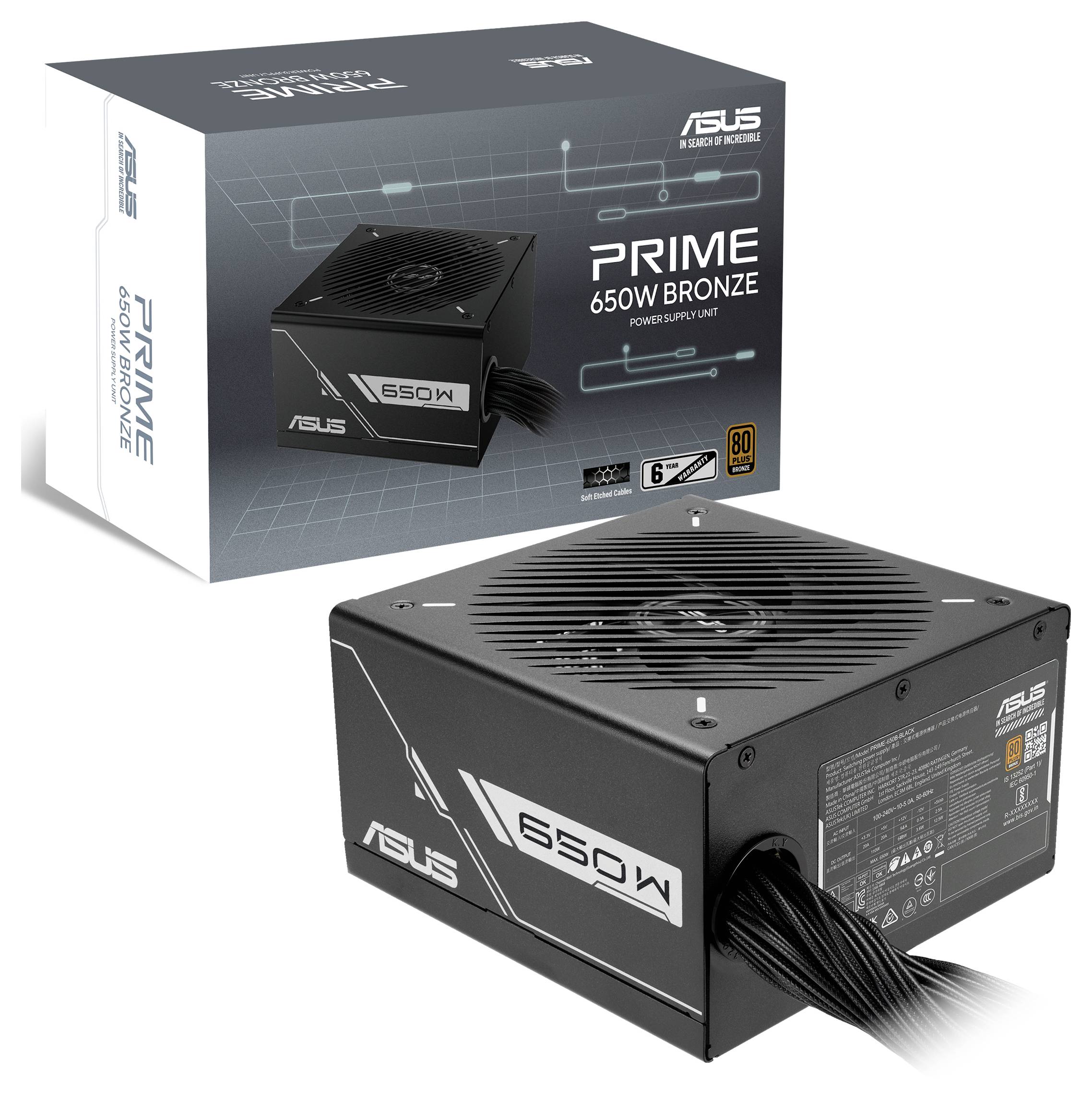 Un bloc d'alimentation noir pour ordinateur étiqueté « PRIME 650W BRONZE » avec des câbles visibles, présenté à côté de sa boîte d'emballage.