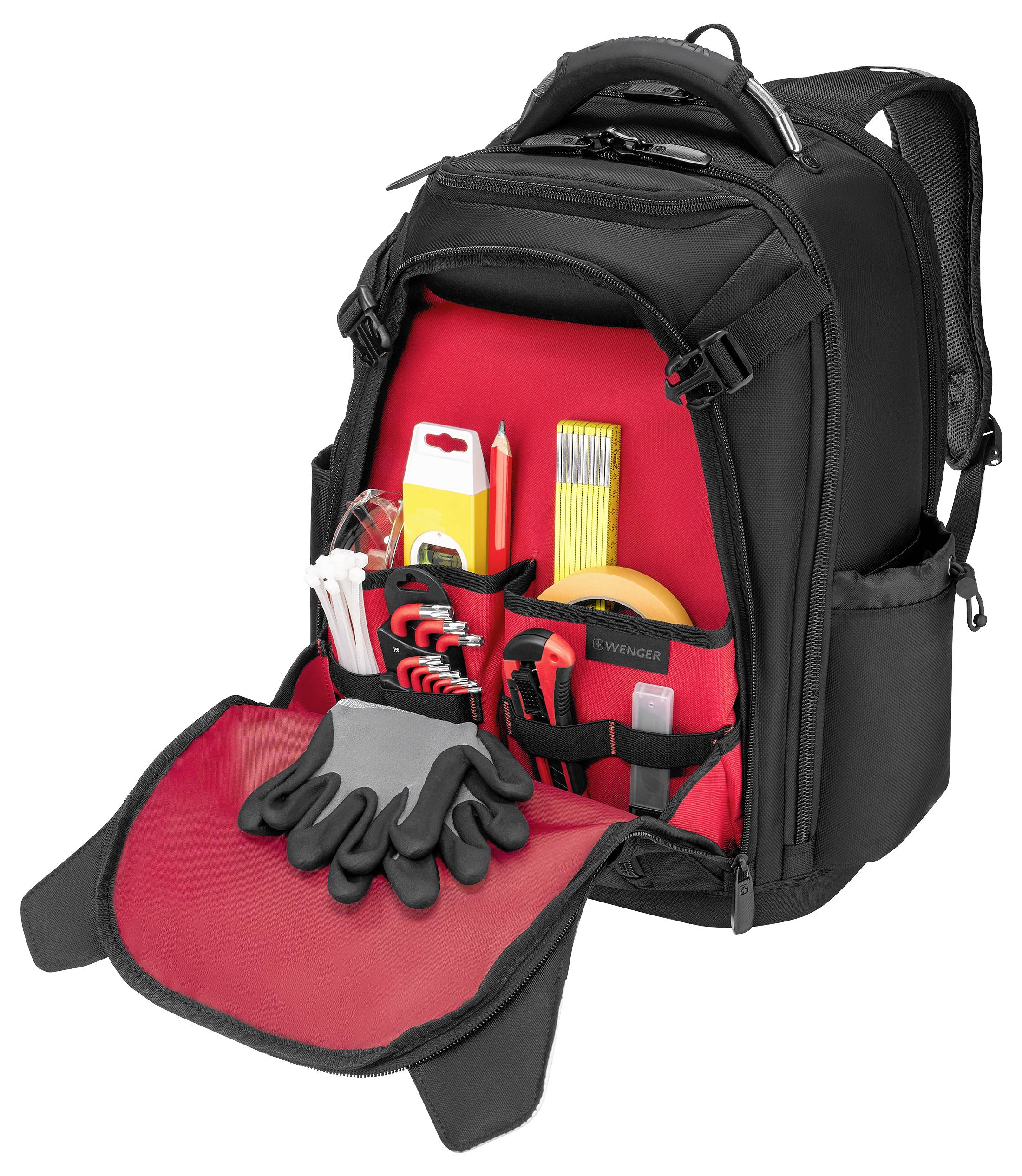 Un sac à dos noir avec un compartiment avant ouvert exposant divers outils, dont des tournevis, des pinces, un mètre ruban et des gants.