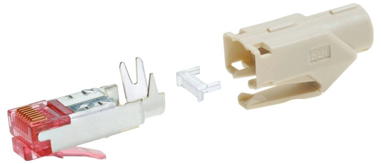Un connecteur Ethernet démonté en trois parties : la fiche métallique aux embouts rouges, un petit élément en plastique et un boîtier en plastique beige.