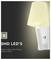 «LED CMS : Puce LED de haute qualité et pilote de puissance.» Image d'une lampe LED murale avec port USB, luisant d'une chaleur douce.