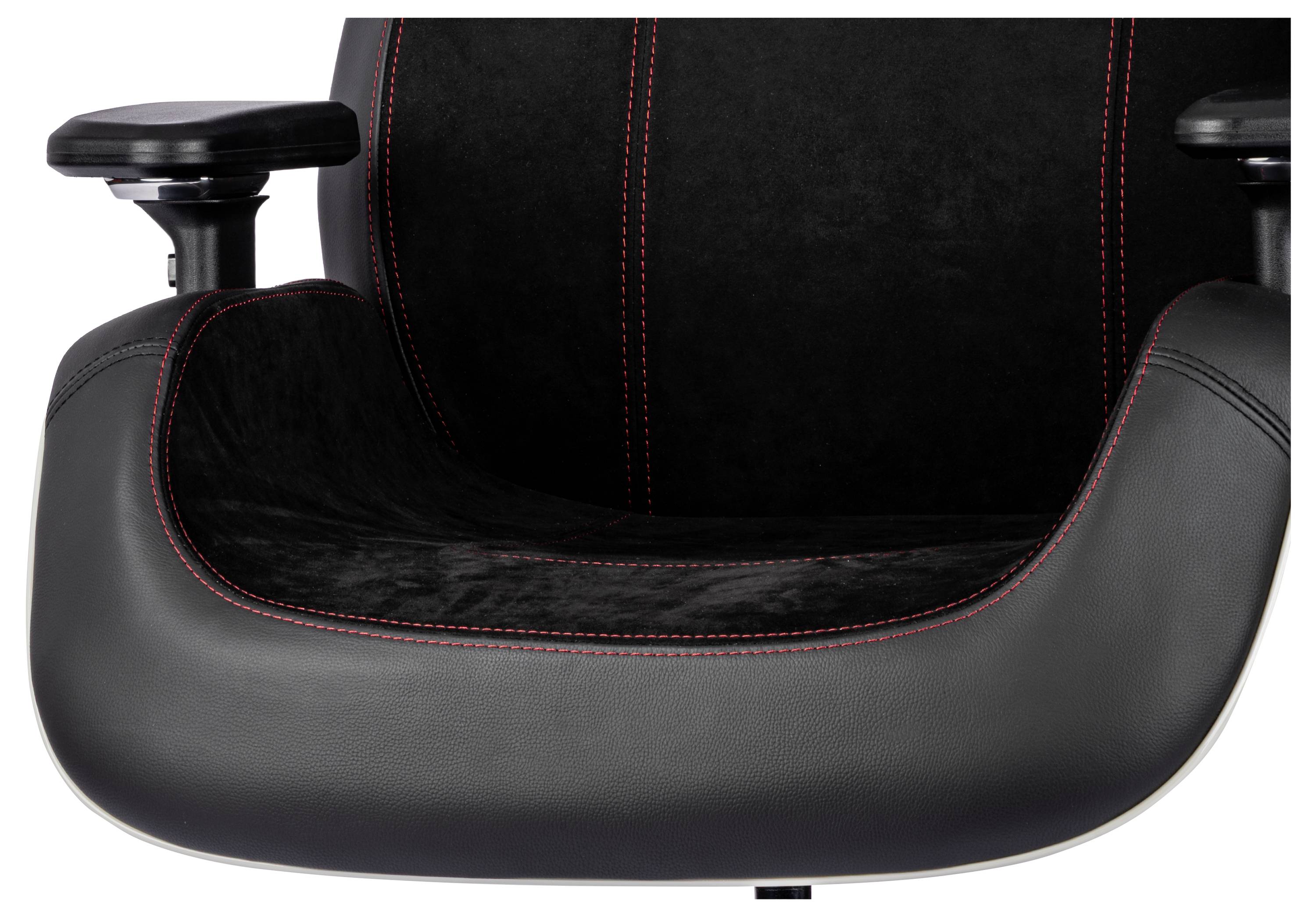 Une chaise en cuir noir avec des coutures rouges, dotée d'accoudoirs et d'un design de siège incurvé offrant un support ergonomique.