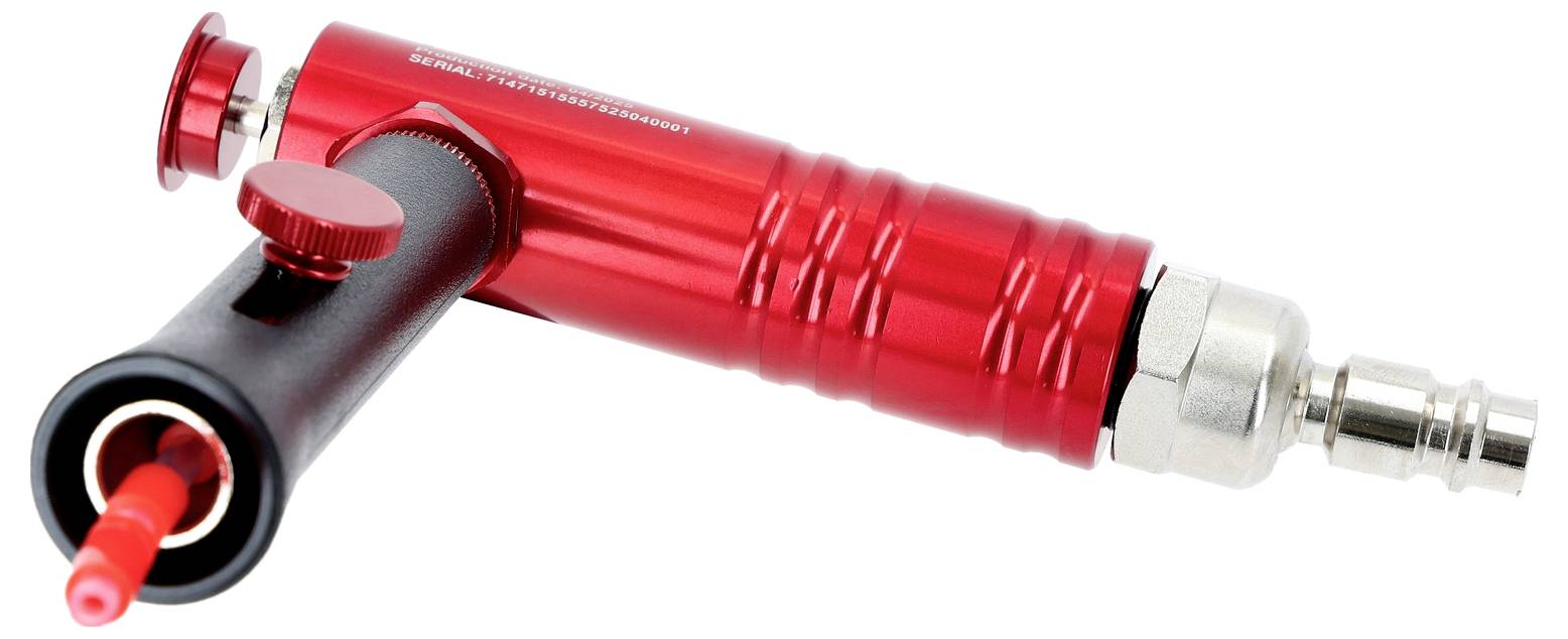 Outil pneumatique industriel rouge et noir avec connecteur métallique, utilisé pour des applications industrielles.