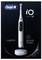 Brosse à dents électrique Oral-B iO Series 10 en blanc stardust, présentant le 'coaching personnalisé en direct iOsense', accompagnée de sa base de chargement.
