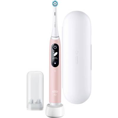 Une brosse à dents électrique rose avec un écran numérique est posée à côté d'un étui de voyage blanc et d'un couvercle transparent sur sa base de chargement.