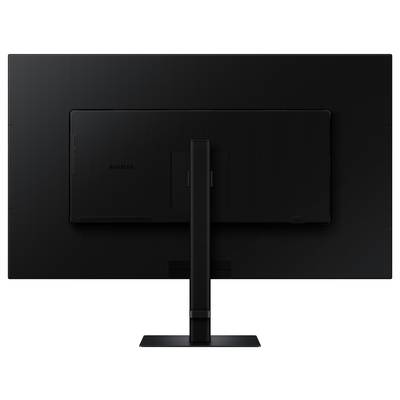 « Un moniteur large noir avec un support, vu de dos, sur un fond uni. »