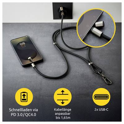 Un smartphone est en charge avec un câble USB-C tressé élégant branché dans une prise murale. L'encart montre un gros plan des connecteurs.