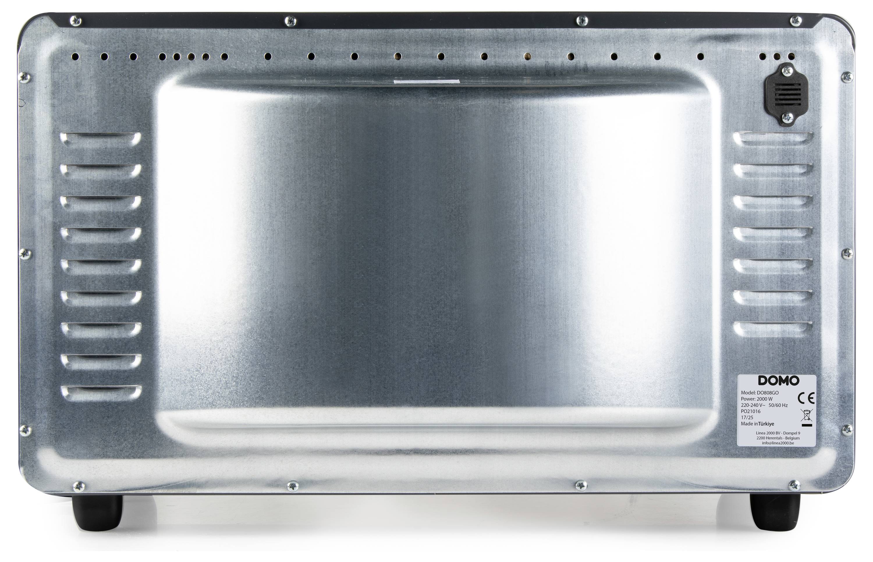 L'image montre l'arrière d'un appareil Domo métallique, présentant des fentes de ventilation et un petit panneau de commande dans le coin supérieur droit.