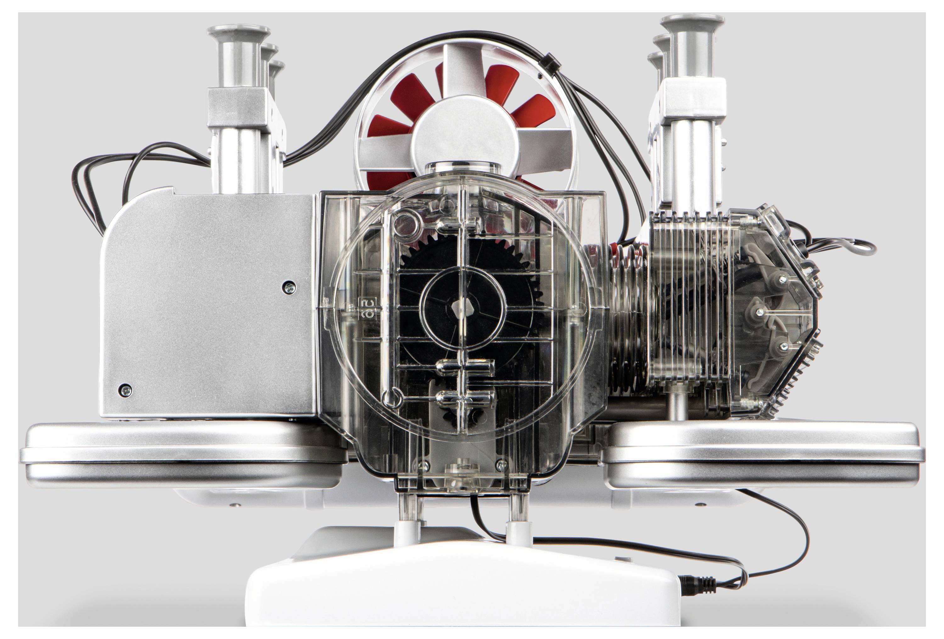 Un dispositif futuriste avec des composants métalliques, un boîtier transparent révélant des engrenages, et un ventilateur rouge, probablement une partie d'une machinerie sophistiquée.