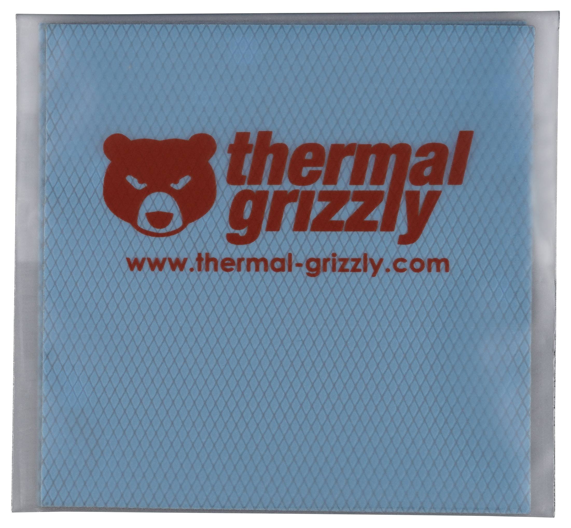 Un carré bleu emballé étiqueté 'thermal grizzly' en rouge, avec un logo d'ours en colère, et une adresse de site web en dessous.