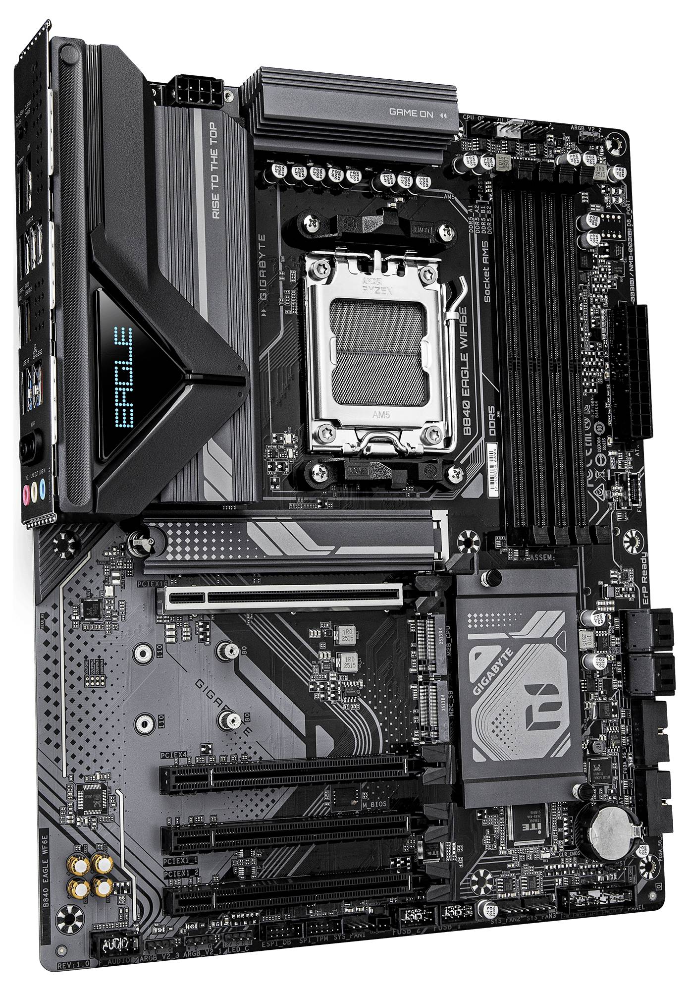 Une carte mère d'ordinateur en noir et gris avec des emplacements étiquetés pour divers composants, notamment le processeur (CPU), la RAM et d'autres connecteurs.