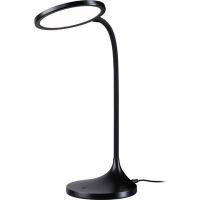 Une lampe de bureau moderne en noir avec un éclairage LED circulaire et un col flexible, branchée et posée sur une surface plane.