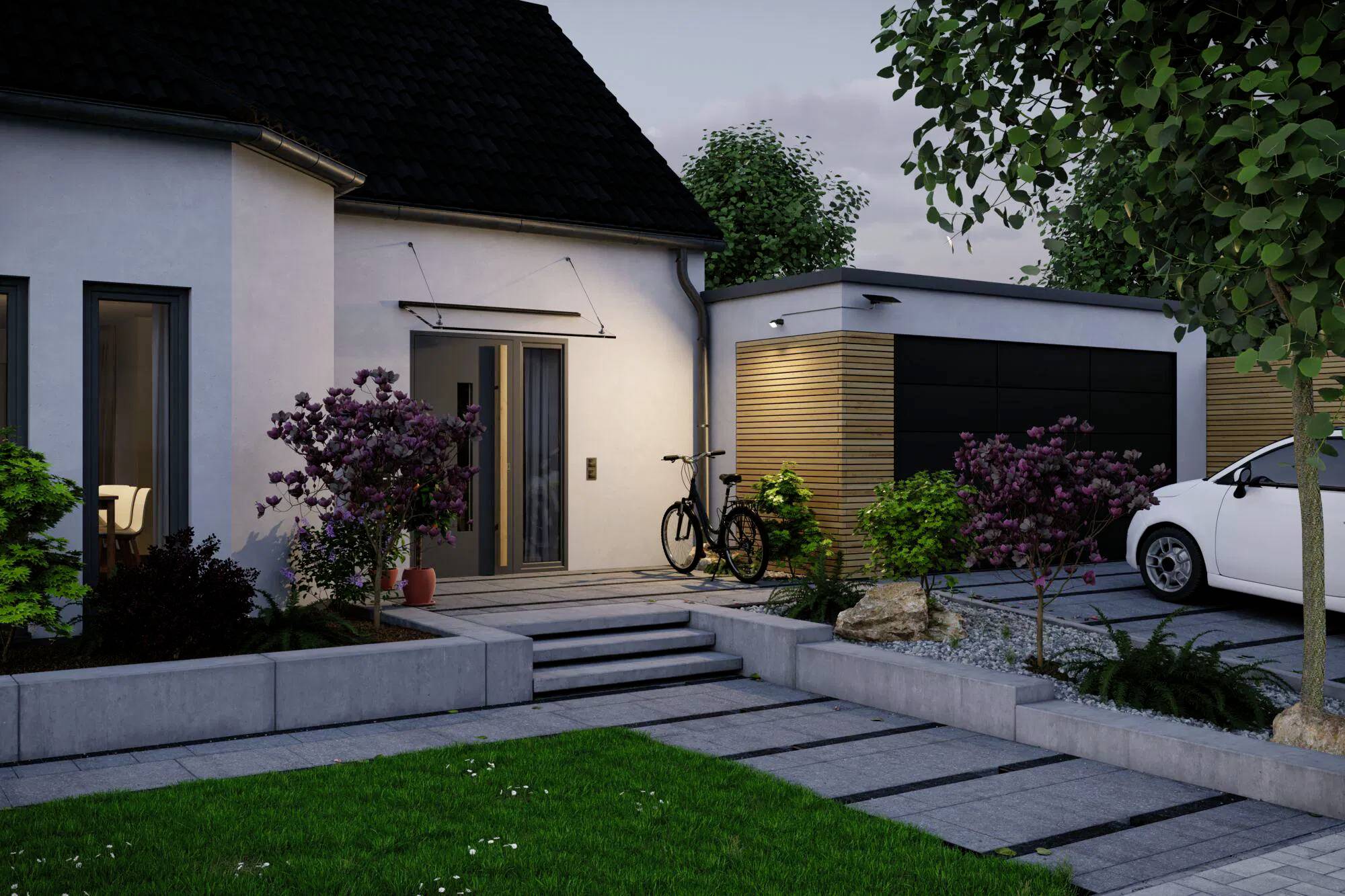 Maison moderne avec un chemin, une entrée éclairée, des arbustes, un vélo près de la porte, et un garage avec une voiture garée à côté au crépuscule.