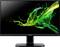 Un moniteur Acer affichant un design éclaboussé abstrait vibrant en vert et jaune sur un fond noir.