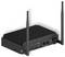 Un appareil électronique noir doté de deux antennes, avec plusieurs ports, notamment USB, HDMI et des connexions réseau, conçu pour la connectivité.