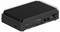 Un ordinateur industriel noir et rectangulaire avec un dessus strié pour la dissipation thermique. Les ports avant comprennent un bouton d'alimentation, USB, Ethernet et HDMI.