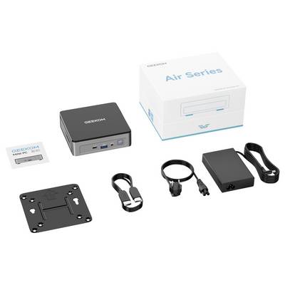 Kit de produit pour un Mini PC GEEKOM, montrant l'ordinateur compact, la boîte de la série « Air », l'adaptateur secteur, la plaque de montage, le câble et les accessoires de sangle.