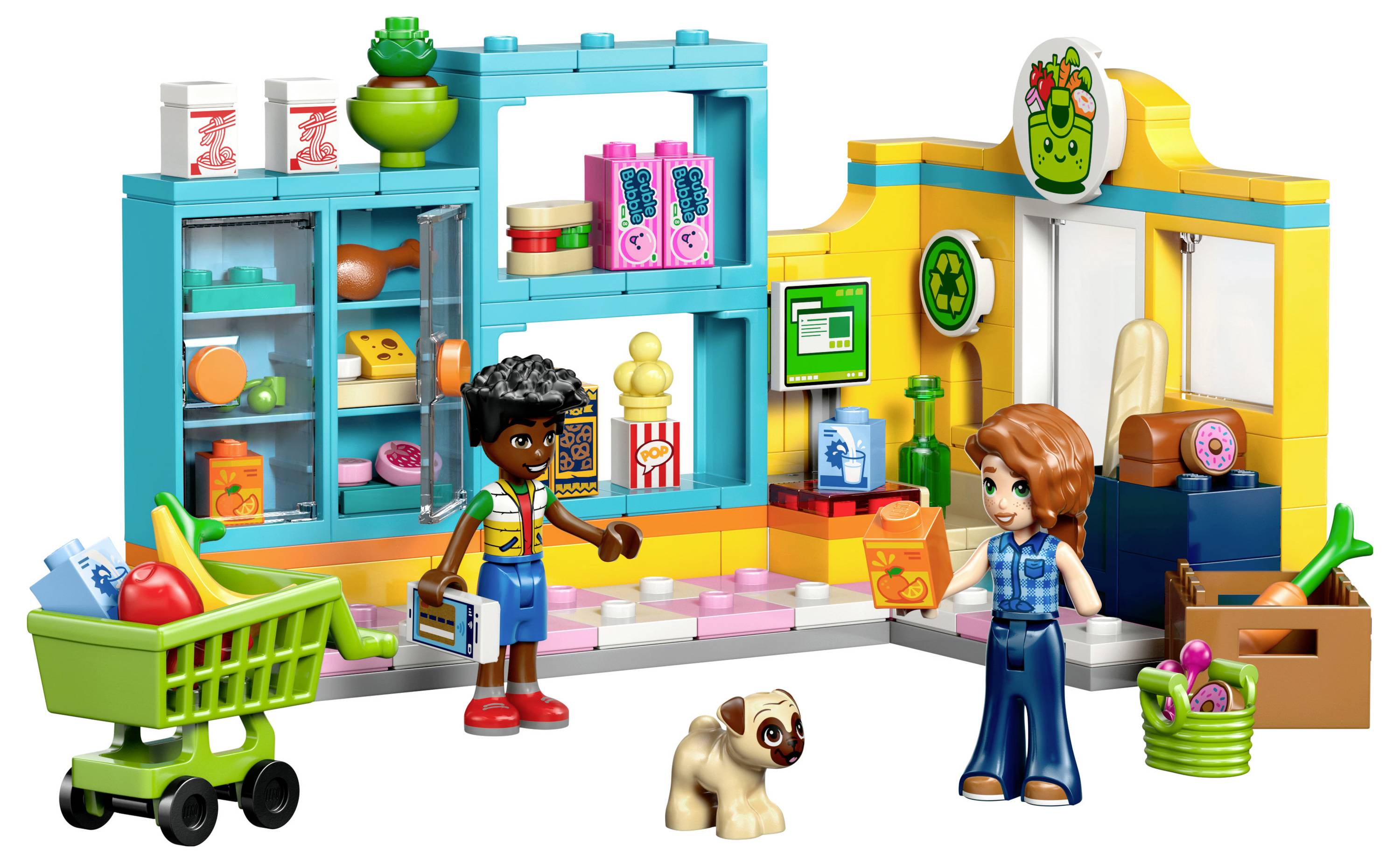 Deux figurines de jouets dans un marché coloré, avec des aliments, un chariot de courses et un chiot. Des étagères affichent des produits d'épicerie, et un panneau vert est suspendu au-dessus.