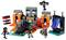 Ensemble Lego représentant des personnages et des structures de Minecraft, comprenant des squelettes, un hommes-cochon, et un portail, disposés sur une plateforme orange.