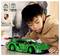 Un enfant portant un sweat à capuche admire une voiture de course verte sur une table. L'image présente les logos Lego et Porsche, un âge recommandé de 11 ans et plus, et un nombre de 1313 pièces.