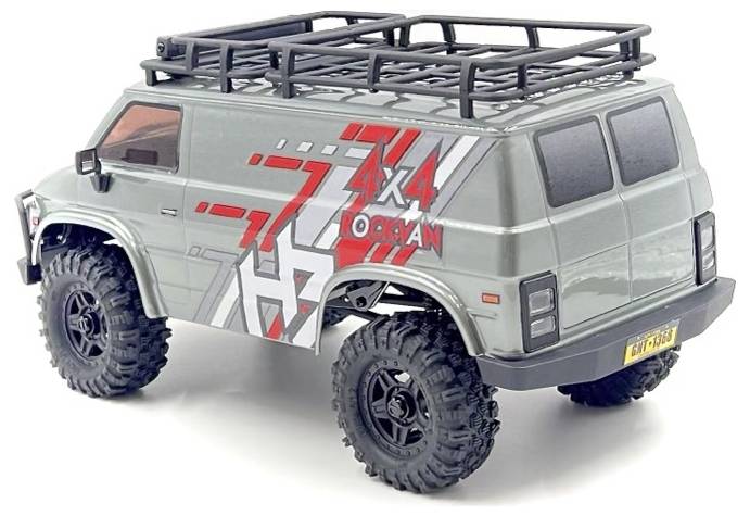 Un fourgon miniature gris avec des pneus tout-terrain porte les inscriptions '4x4' et 'Ocean' en rouge sur son flanc. Il est équipé d'un galerie de toit et d'une plaque d'immatriculation arrière.