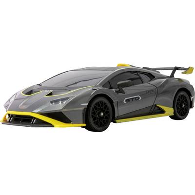 Une voiture de sport grise avec des touches jaunes, vue en angle depuis l'avant, mettant en valeur un design élégant et des caractéristiques aérodynamiques.