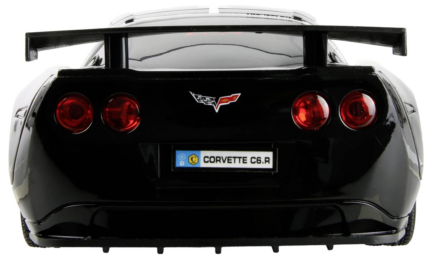 L'image montre la vue arrière d'un modèle réduit de Corvette C6.R noir, avec des feux arrière rouges et une plaque d'immatriculation bien visible portant l'inscription 'CORVETTE C6.R'.