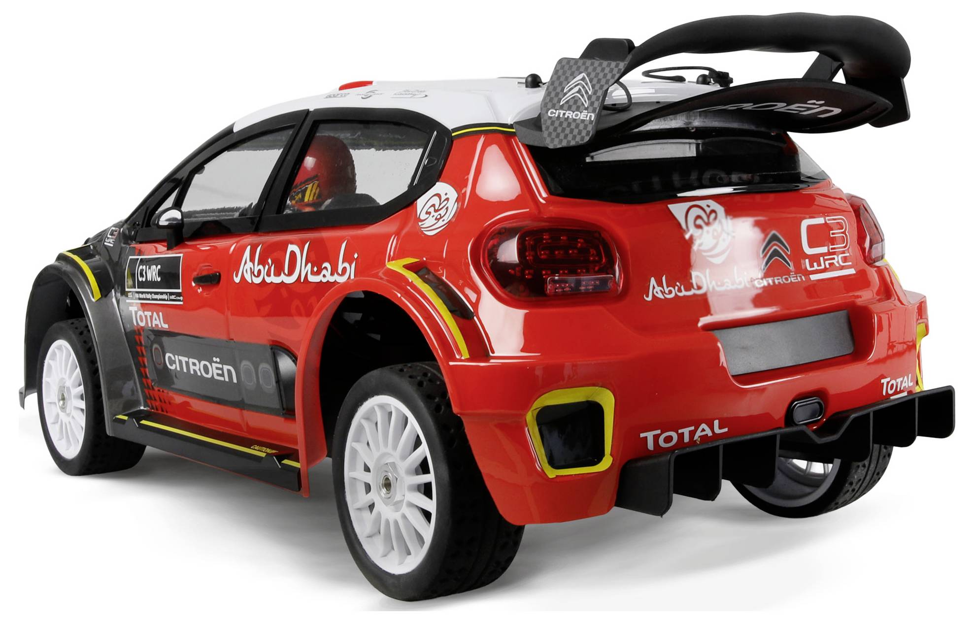 Une voiture de course rouge et blanche avec des logos, un aileron arrière et des pneus robustes, présentée de l'angle arrière dans un environnement de studio.