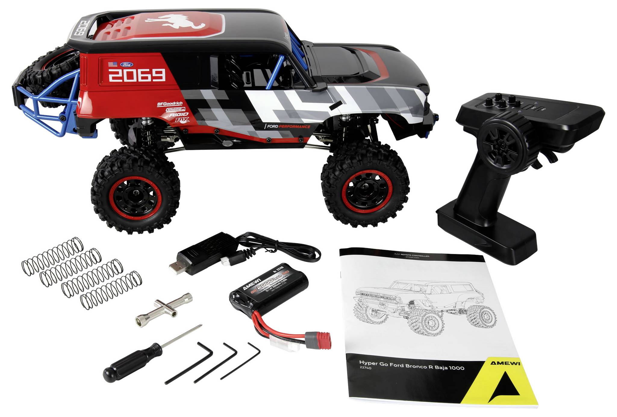 Ensemble de voiture télécommandée comprenant un modèle de véhicule rouge et noir, une télécommande, un pack de batterie, un chargeur, des ressorts, des outils et un manuel.