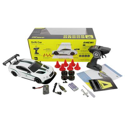 'Ensemble de voiture RC dérive' comprend une voiture jouet blanche avec télécommande, chargeur, roues de rechange, cônes rouges, manuels d'instructions et piles.