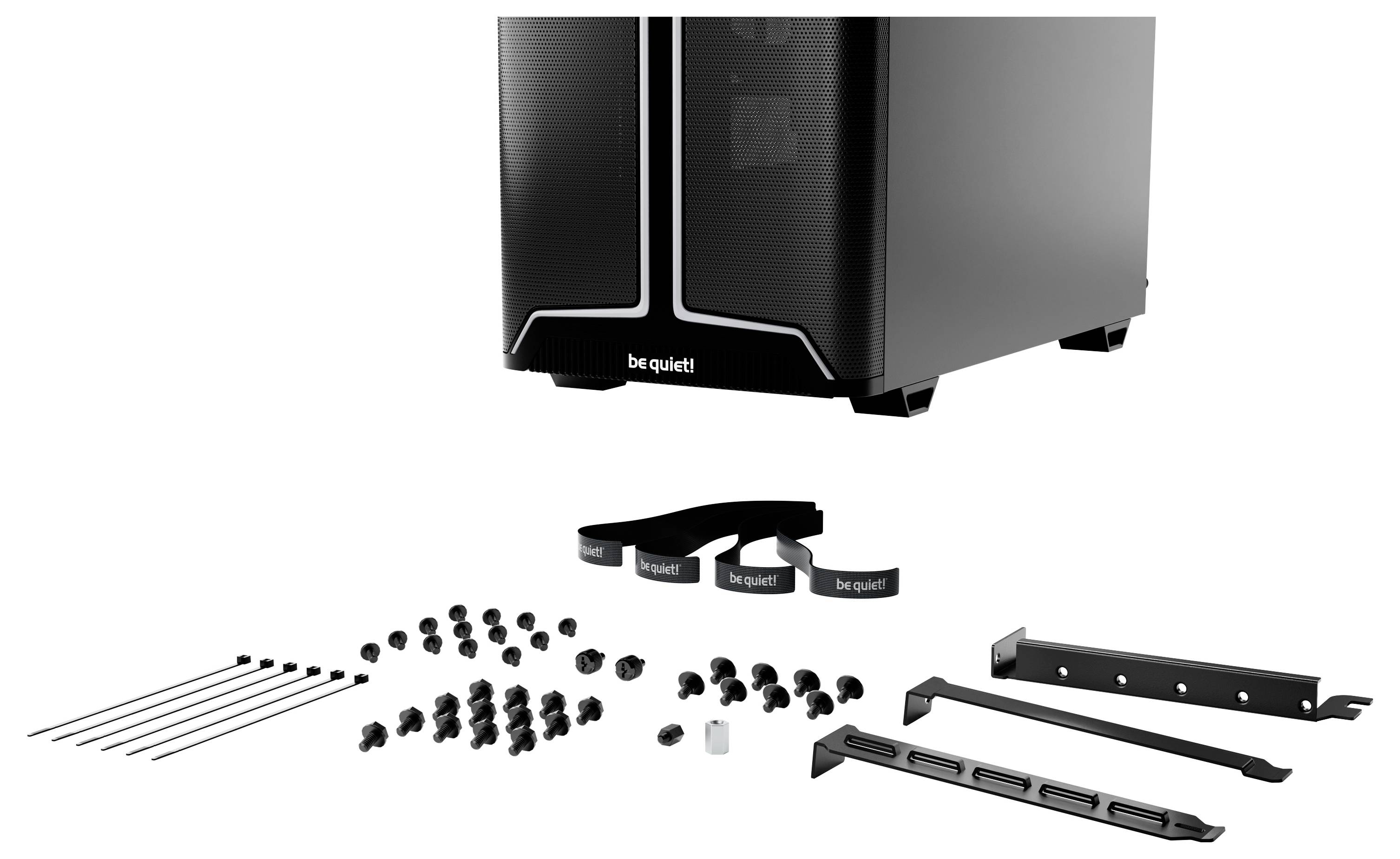 Boîtier de tour d'ordinateur « Silence ! » avec divers outils d'installation et composants matériels, comprenant des vis, des sangles et des supports.