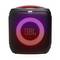 Enceinte portable avec un anneau lumineux et le logo 'JBL', émettant des lumières LED multicolores, suggérant une expérience sonore vibrante et dynamique.
