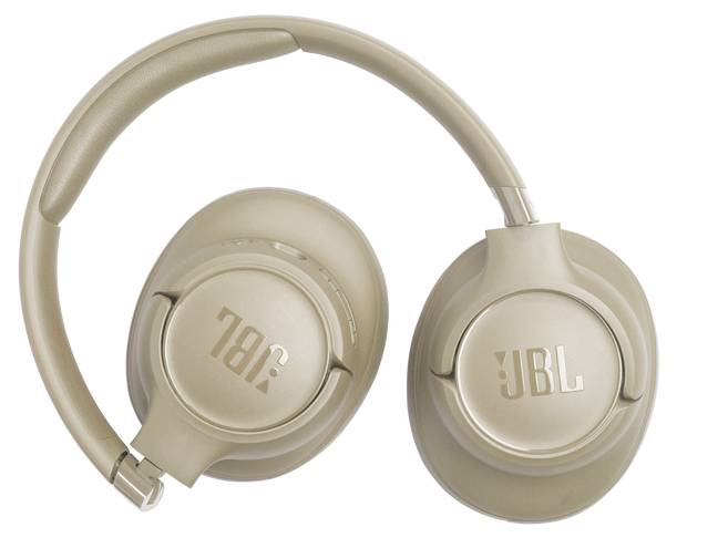 Casque audio sans fil supra-auriculaire de couleur beige, présentant le logo JBL, montré en vue de dessus avec les écouteurs et le serre-tête visibles.